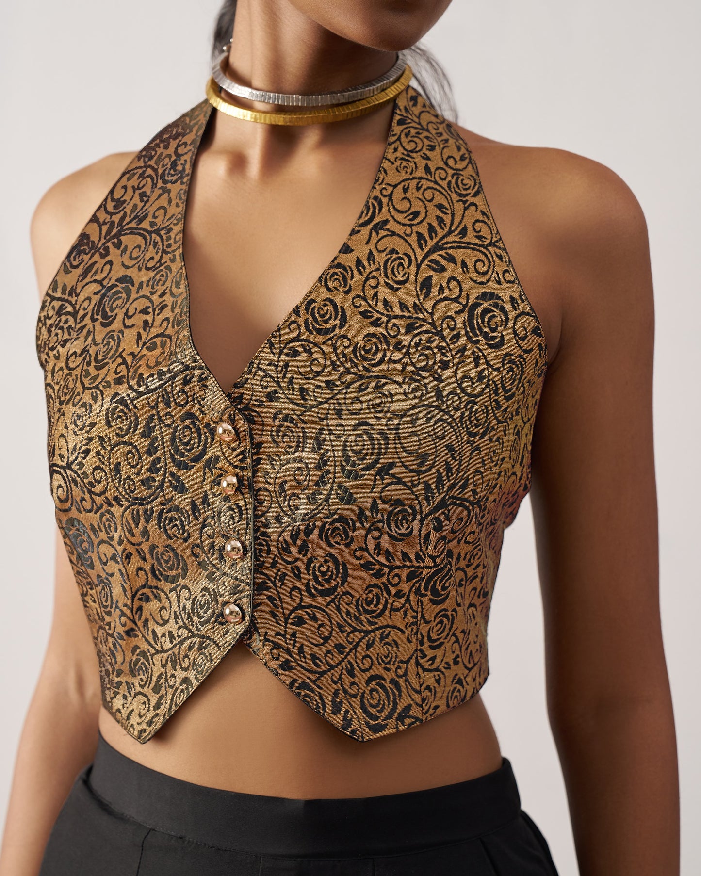 Patterned vest worn by a person on a plain background