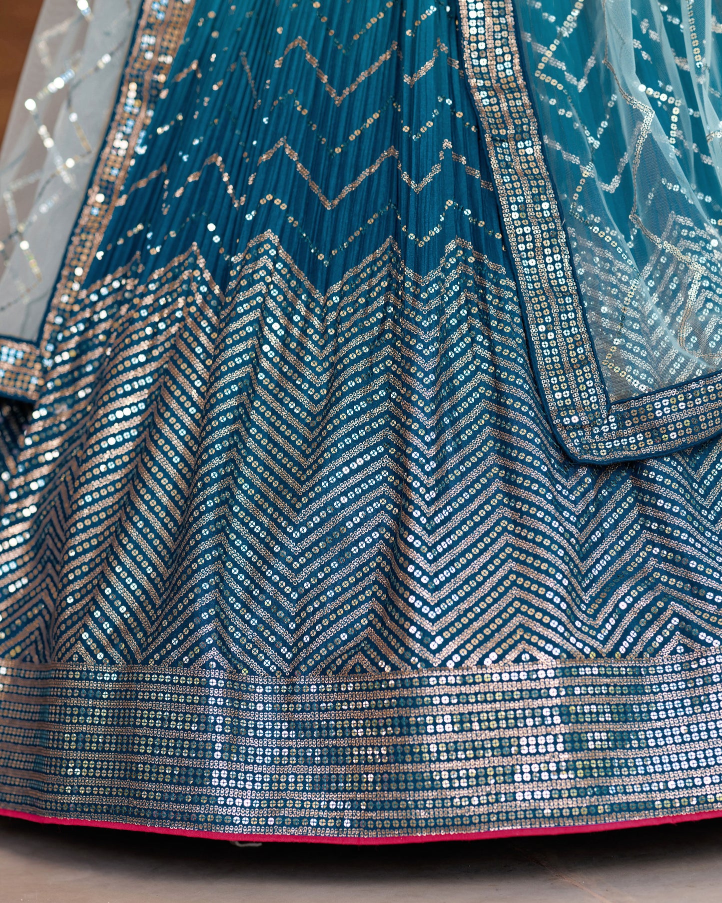 Close-up of a blue and silver patterned fabric with a chevron design.