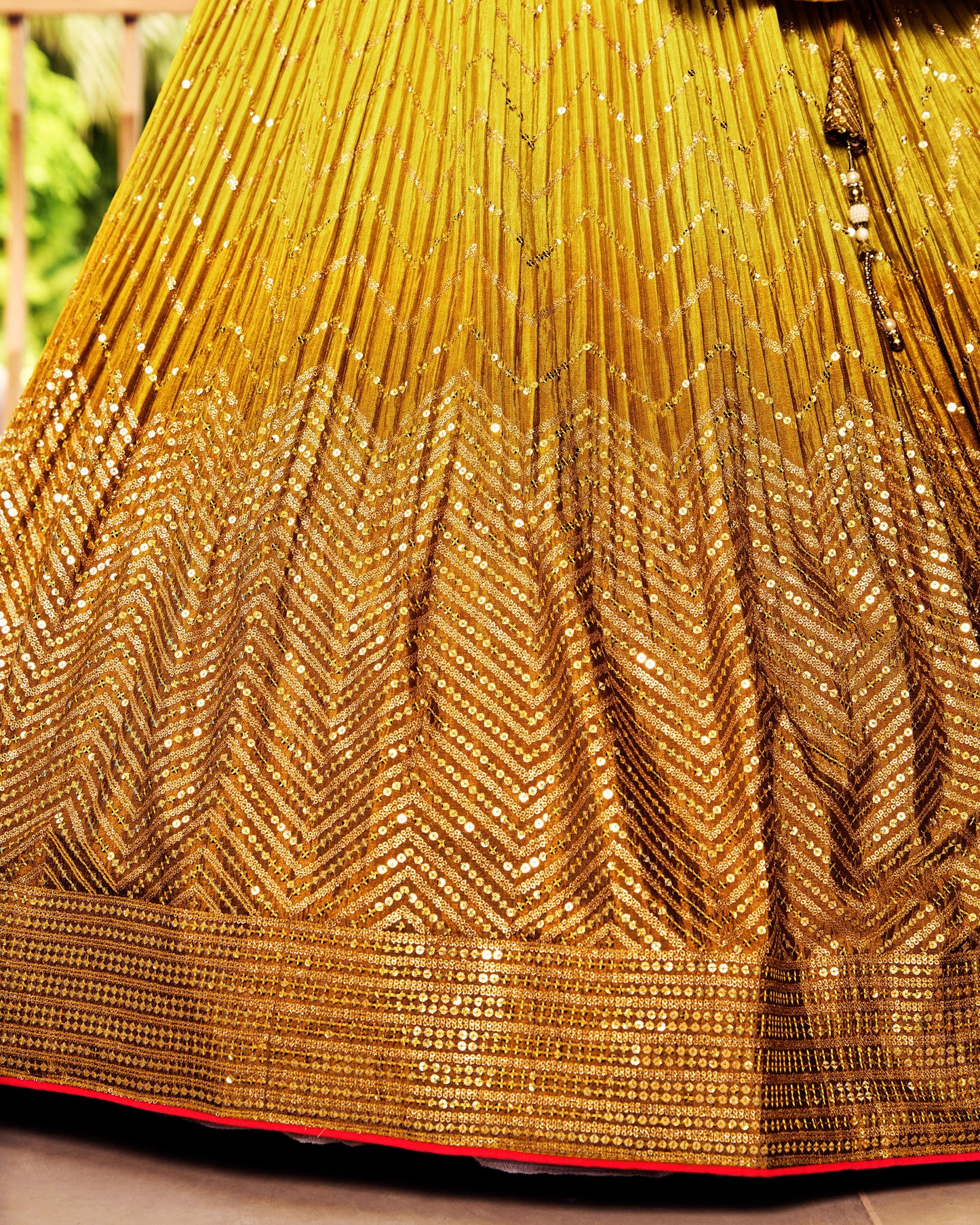 Close-up of a gold saree with intricate patterns