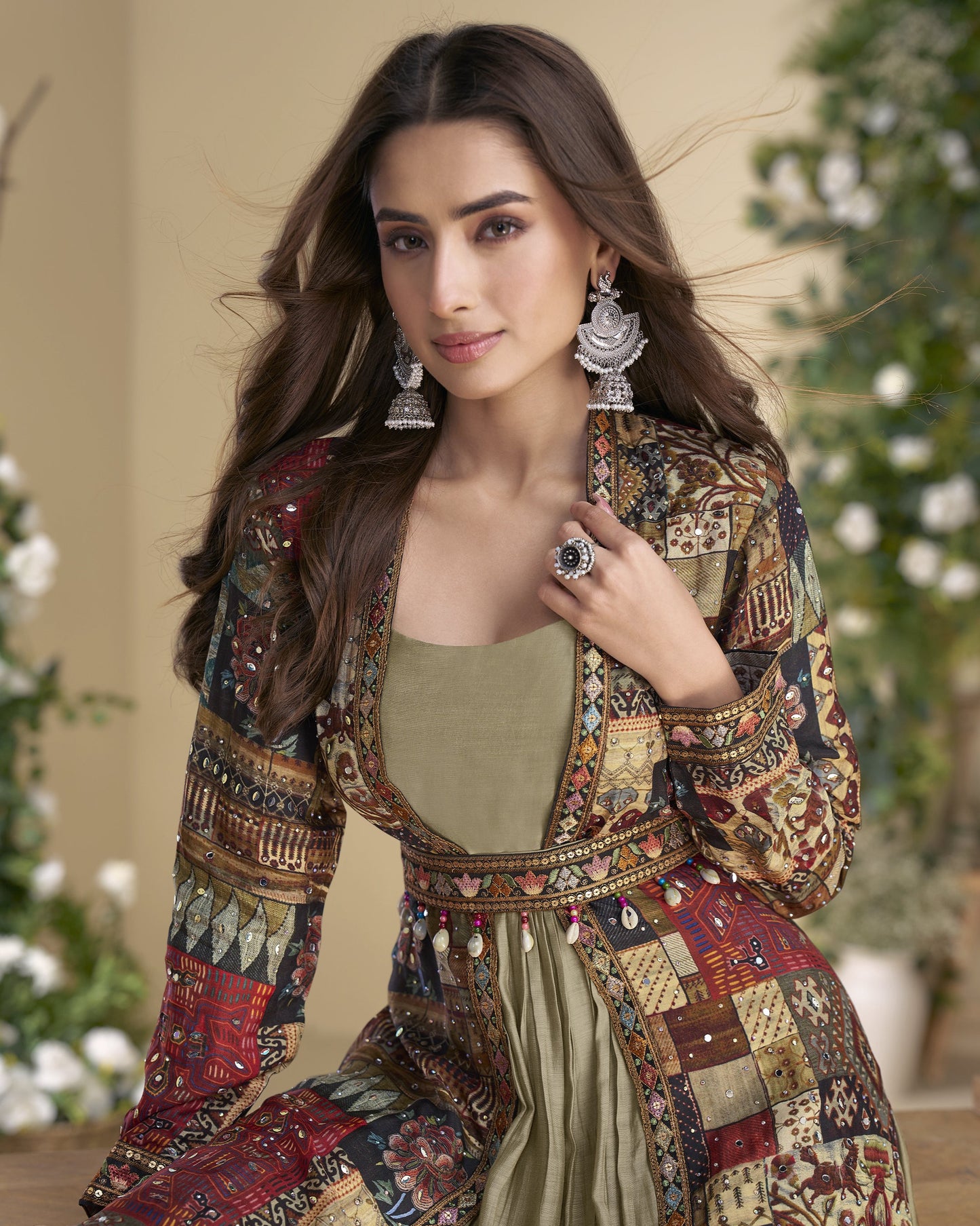 Woman wearing a colorful patterned outfit with a neutral background