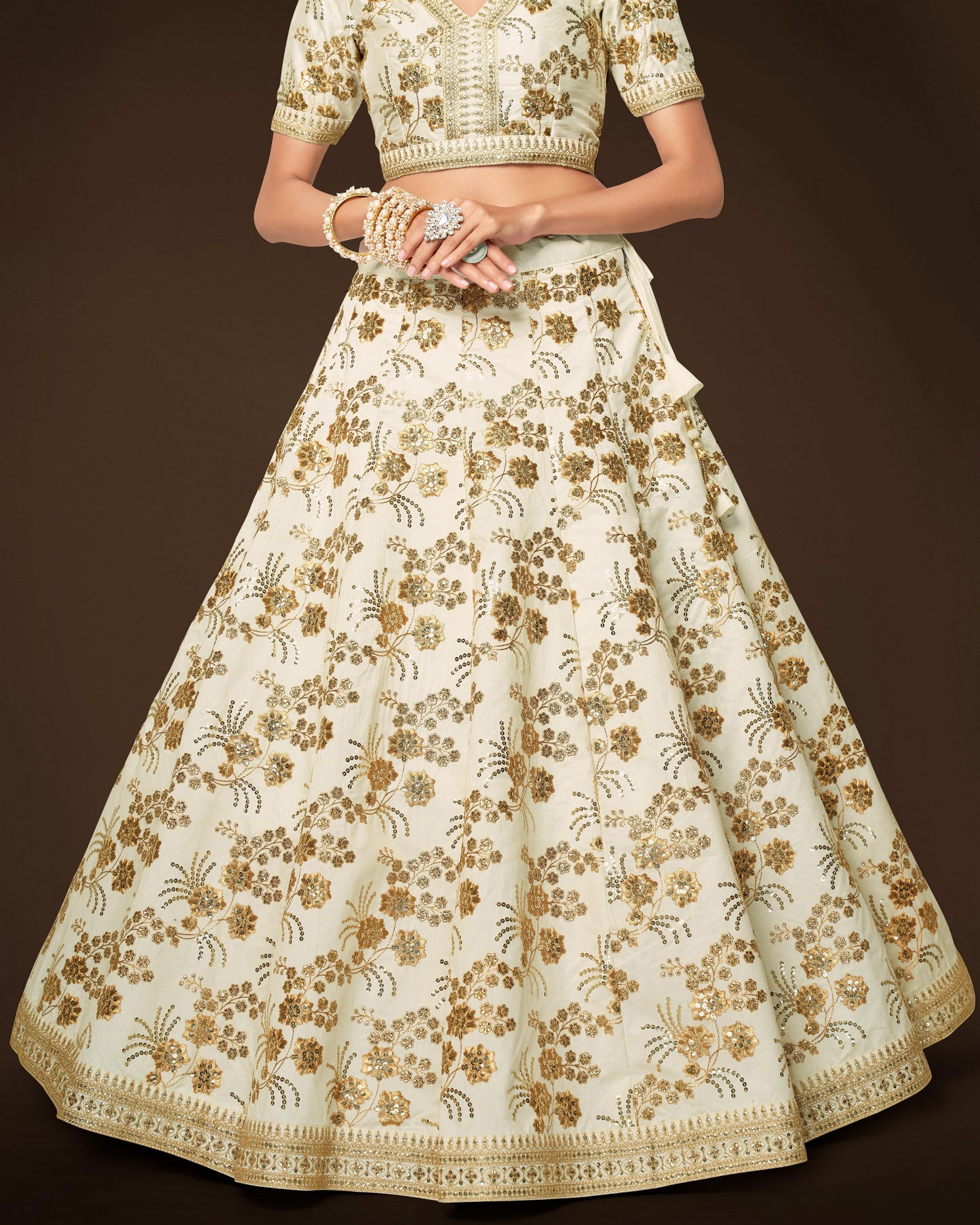 Traditional embroidered outfit with a floral pattern on a dark background