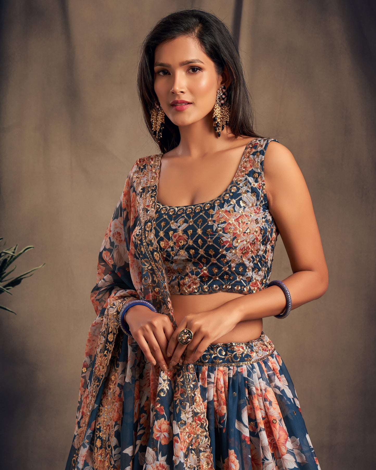 Woman wearing a floral dress against a brown background