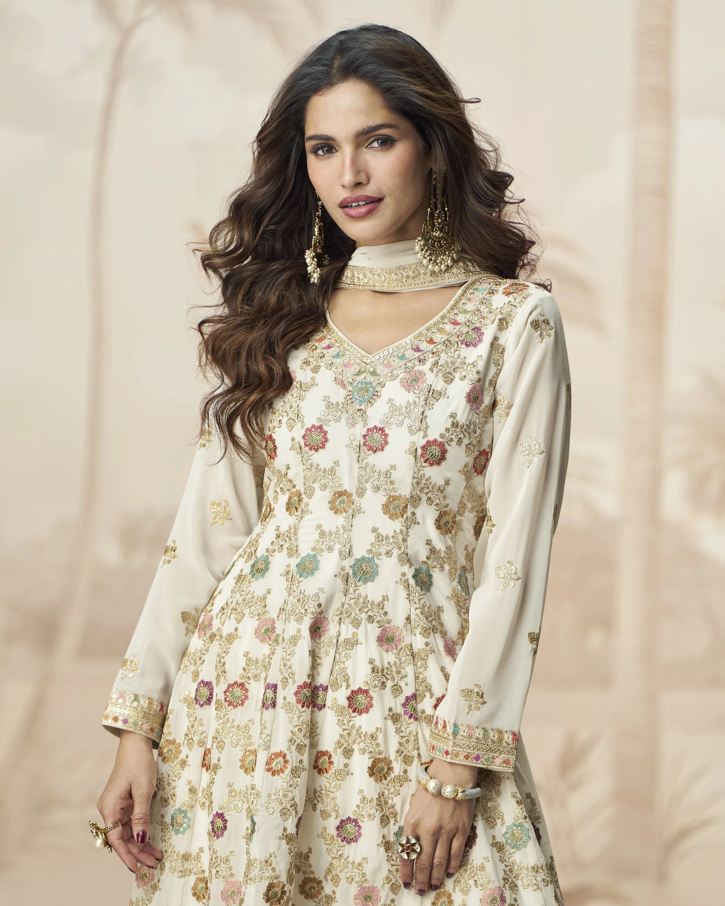 Woman wearing a floral dress with a plain background