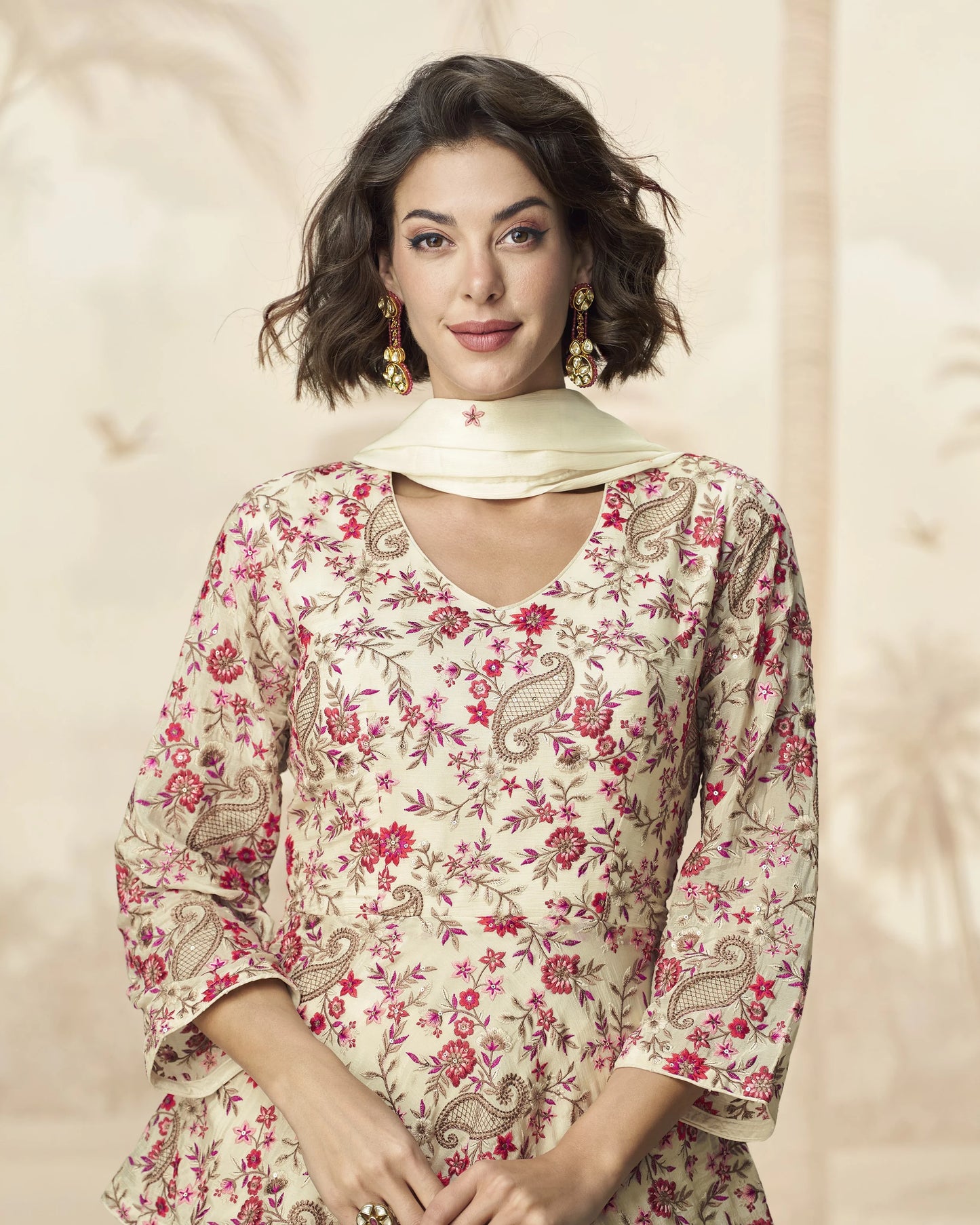 Woman wearing a floral dress with a plain background
