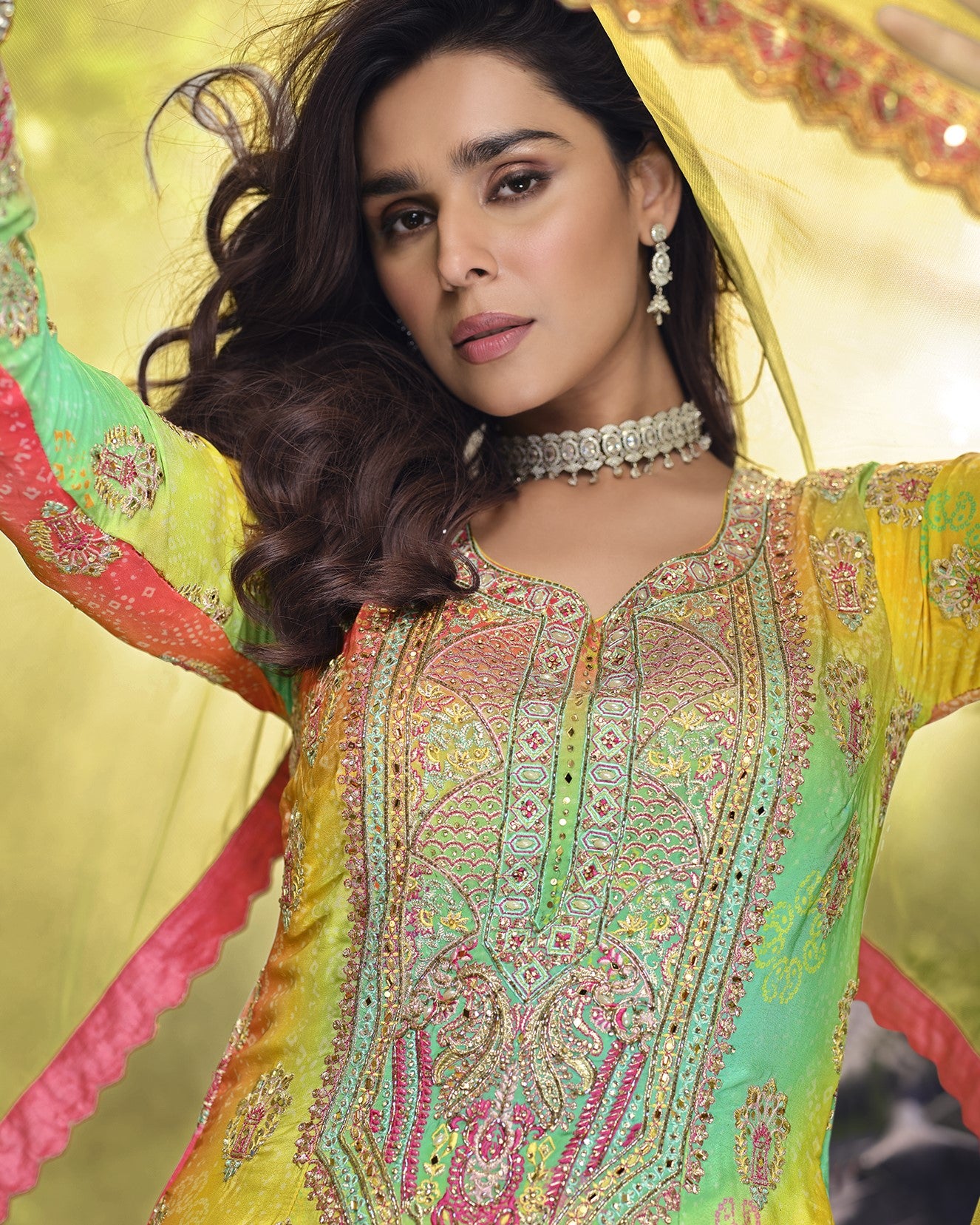 Woman in a colorful traditional outfit with intricate patterns