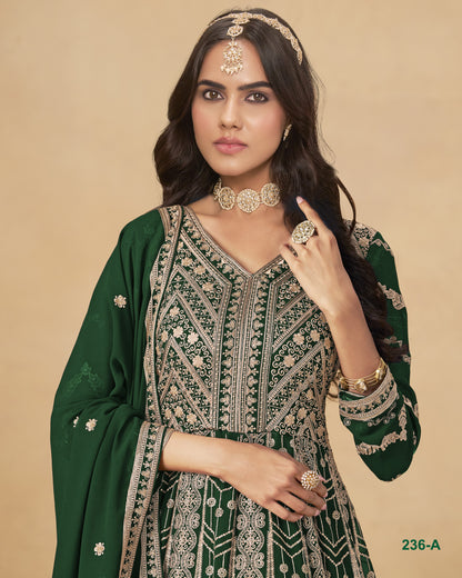 Woman wearing a green and gold traditional outfit with jewelry on a beige background