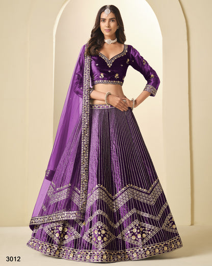 Woman wearing a purple embroidered traditional outfit with a matching dupatta.