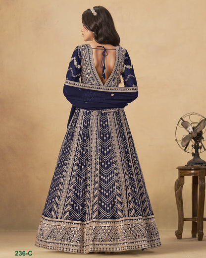 Woman wearing a blue and white patterned dress with a beige background