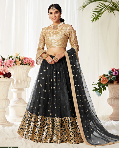 Woman wearing a black and gold traditional outfit with a white background