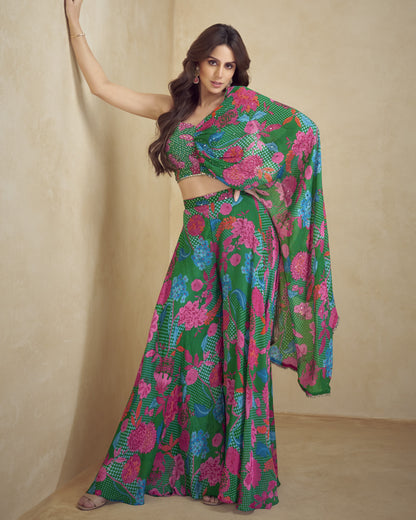 Woman wearing a colorful floral saree against a beige background
