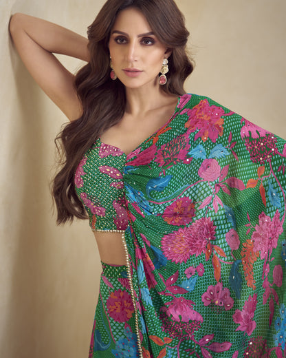Woman wearing a colorful floral saree against a beige background