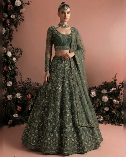 Woman wearing a green embroidered traditional outfit with a floral background