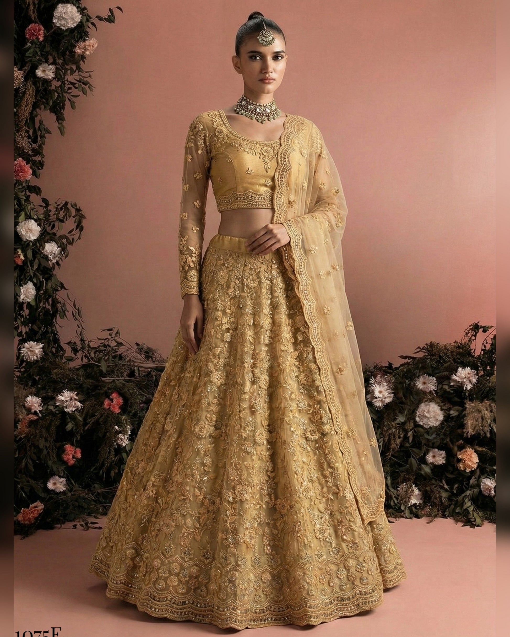 Woman wearing a gold embroidered traditional outfit with a floral background
