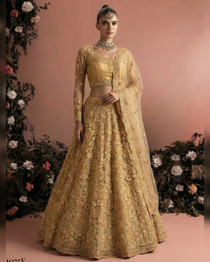 Woman wearing a gold embroidered traditional outfit with a floral background