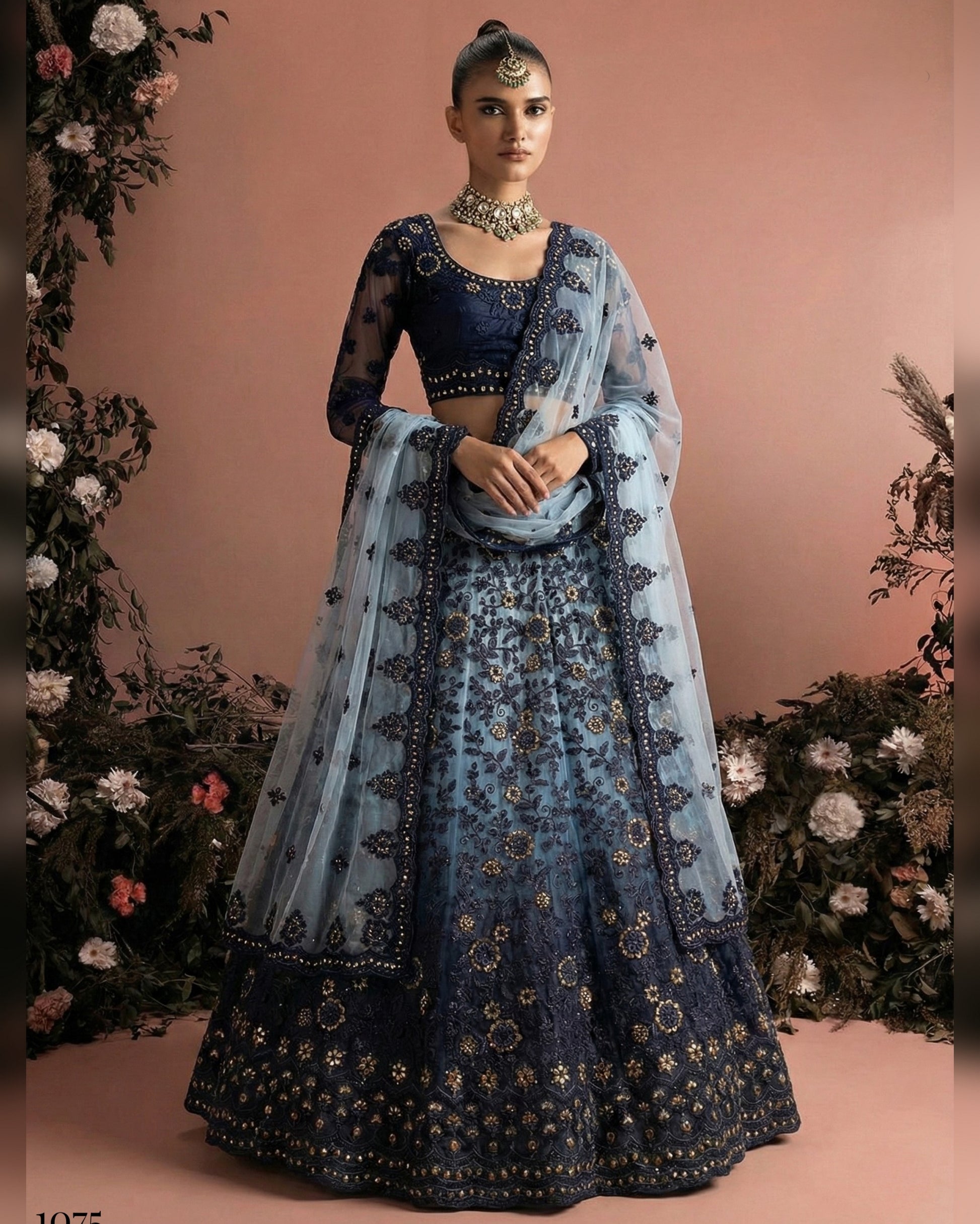 Woman wearing a traditional blue and black embroidered outfit with a floral background
