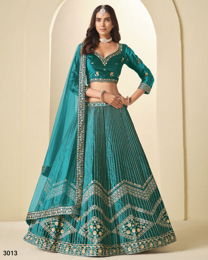 Teal embroidered lehenga with matching blouse against a neutral background