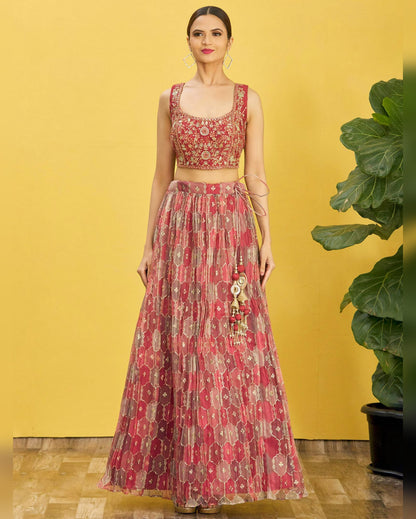 Woman wearing a red floral dress against a yellow background