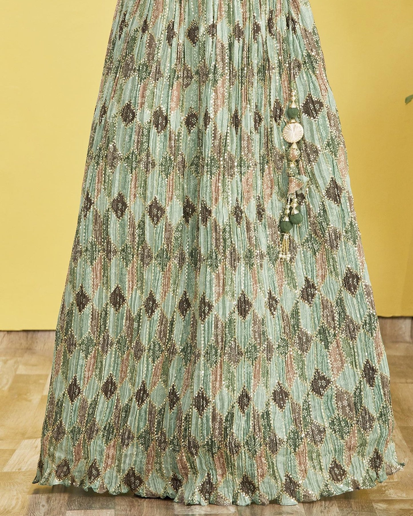 Long, patterned dress with decorative elements on a yellow background