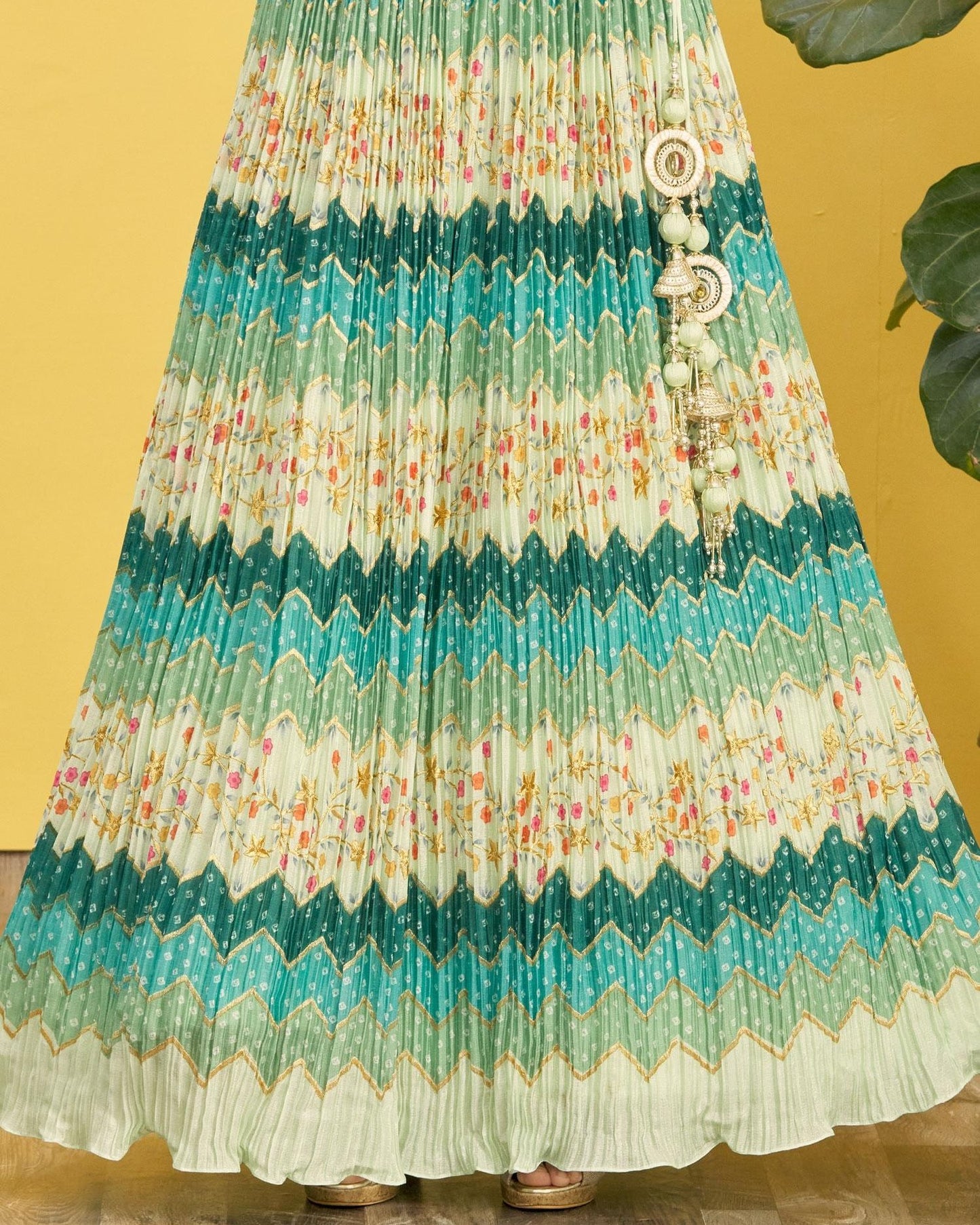 Colorful pleated skirt with a pattern on a yellow background