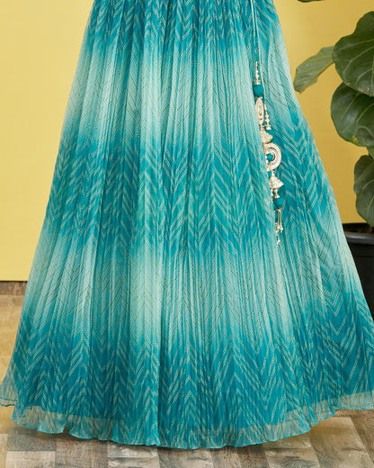Teal patterned fabric with decorative elements on a yellow background