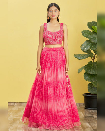 Woman wearing a pink traditional outfit with a yellow background