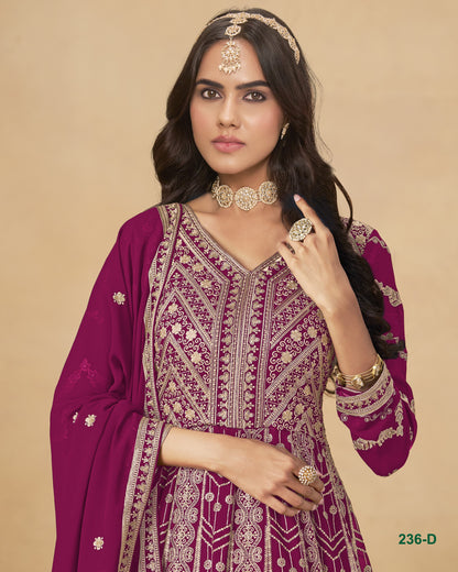 Woman wearing a purple embroidered traditional outfit with jewelry on a beige background