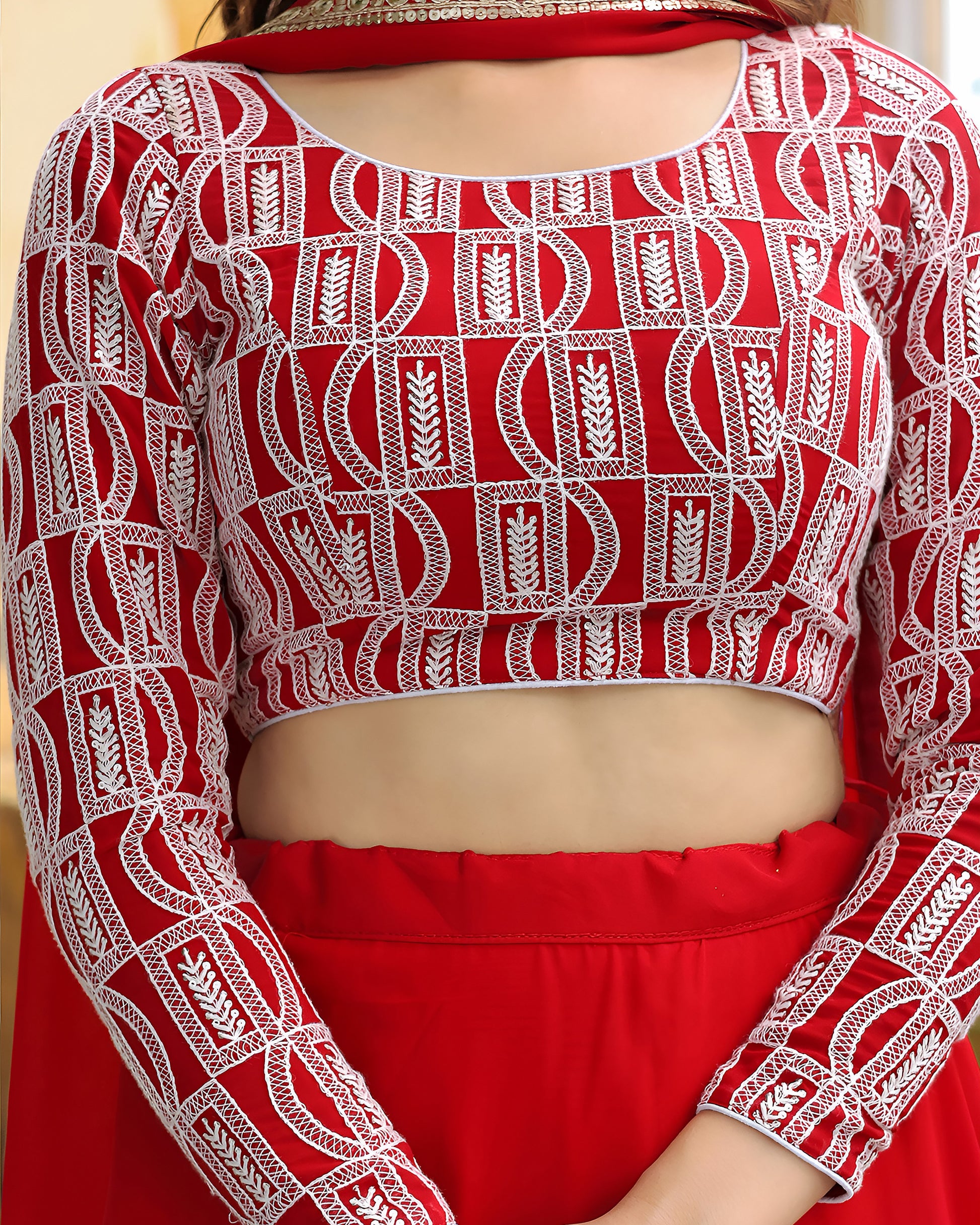 Red and white patterned blouse with a matching skirt