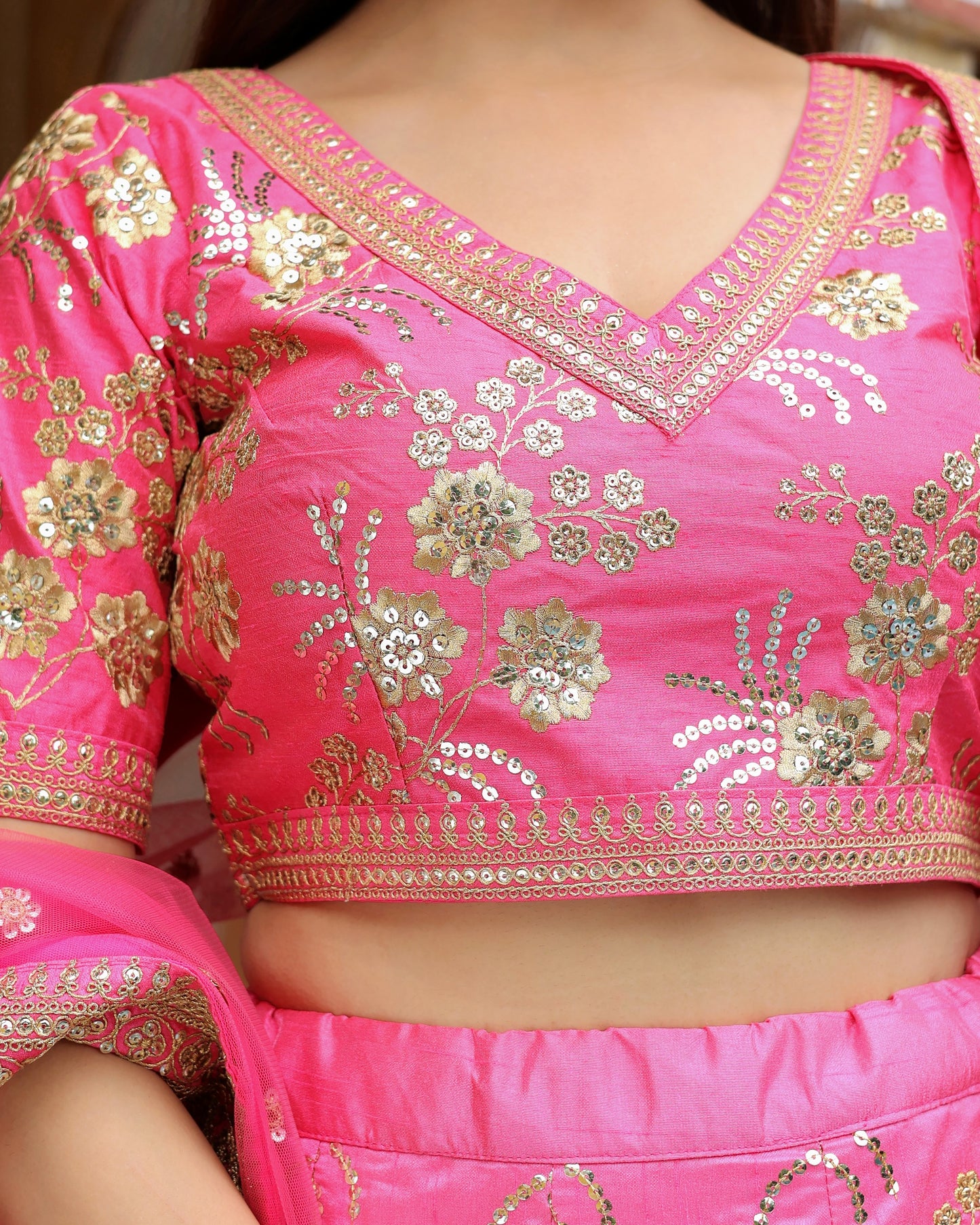 Pink embroidered blouse with gold details