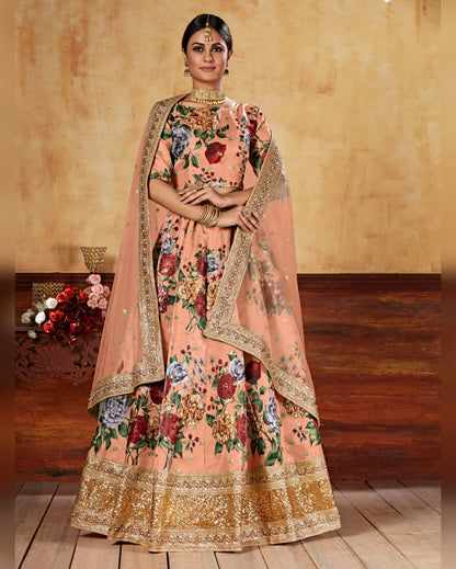 Woman wearing a traditional peach-colored outfit with floral patterns and gold accents.