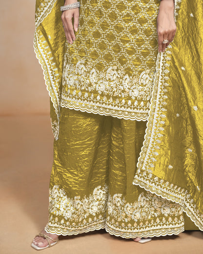 Yellow traditional outfit with white embroidery on a beige background