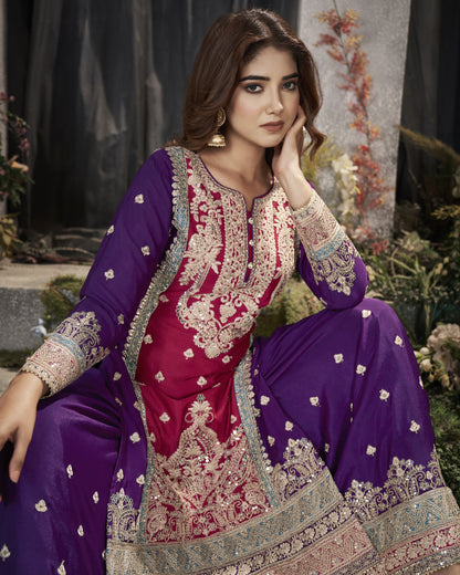 Woman wearing a traditional embroidered outfit with a purple and pink color scheme.