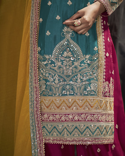 Close-up of a person wearing a traditional embroidered outfit with intricate patterns.