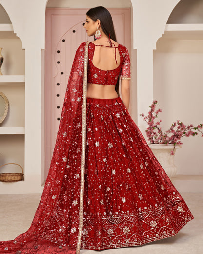 Red embroidered traditional outfit with a matching dupatta against a neutral background