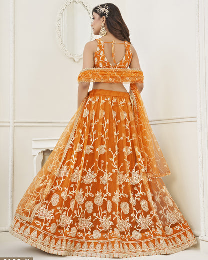 Orange embroidered lehenga with white floral patterns on a white background