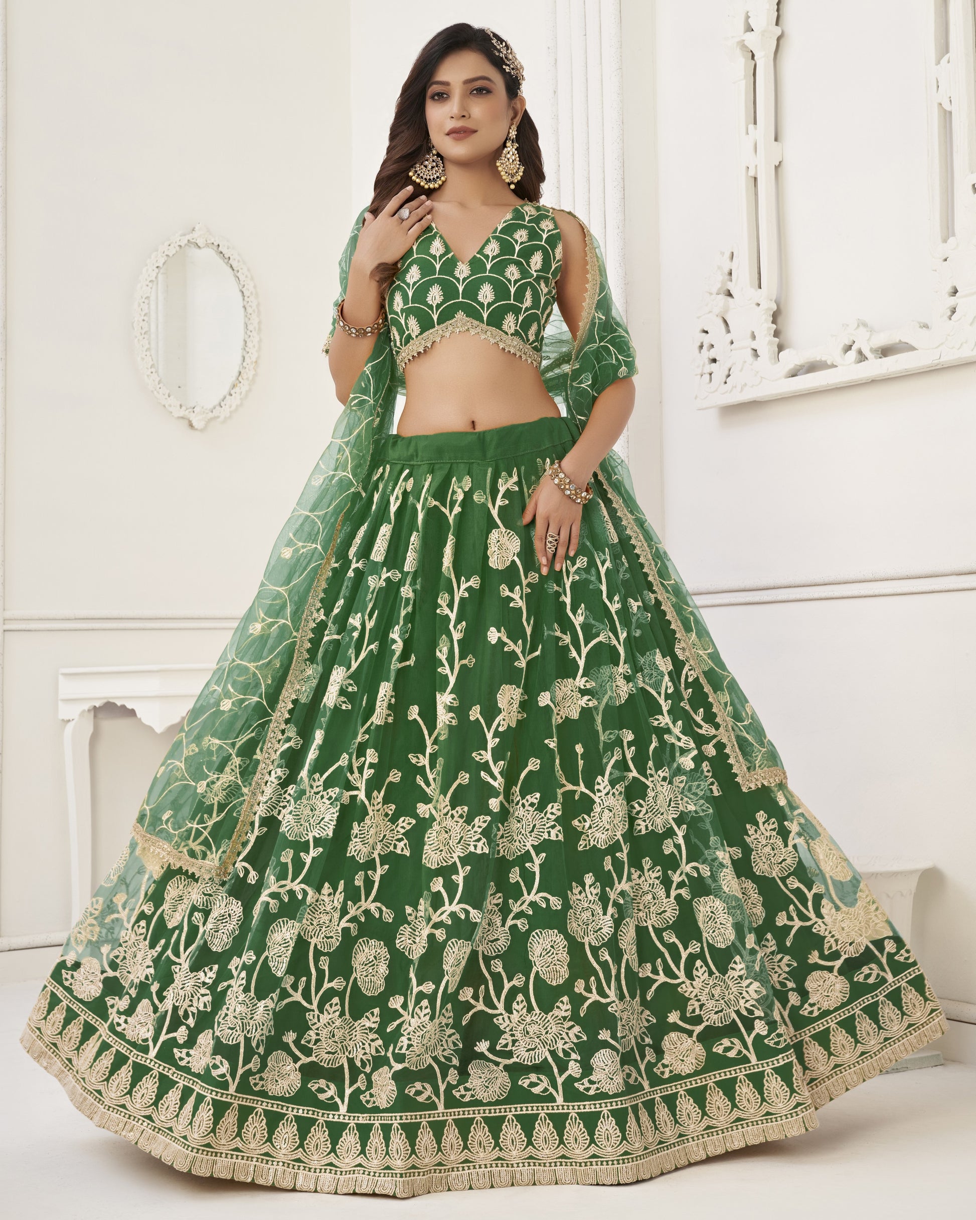 Green embroidered lehenga with matching blouse on a white background