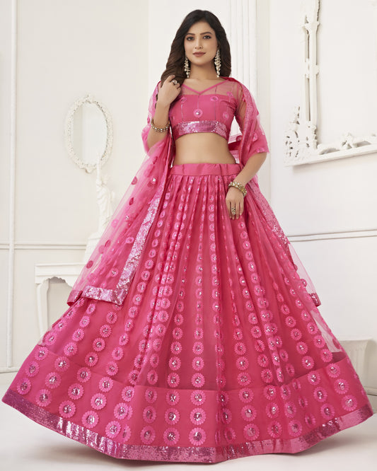 Woman wearing a pink traditional outfit with a white background