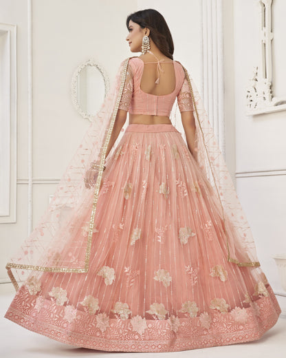 Pink embroidered lehenga with a white background