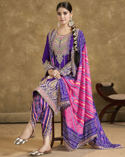 Woman wearing a traditional outfit with a purple and pink patterned dupatta against a beige background
