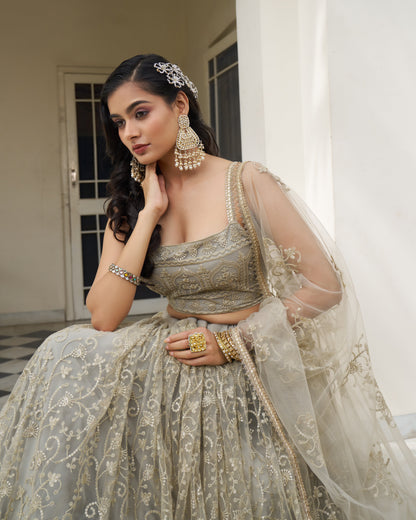 Woman in traditional outfit with jewelry indoors