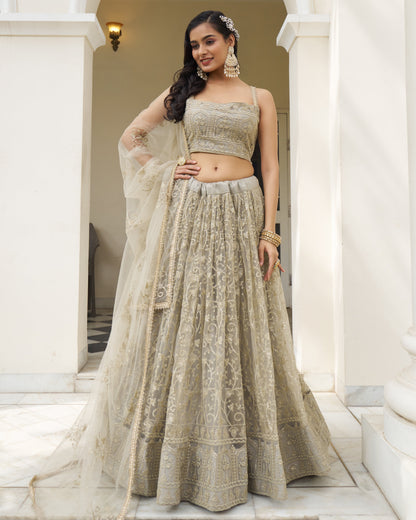 Woman in a traditional outfit standing in a well-lit indoor setting