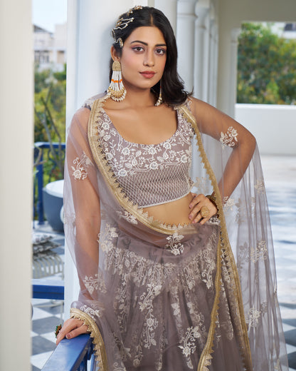Woman in traditional outfit with floral patterns outdoors
