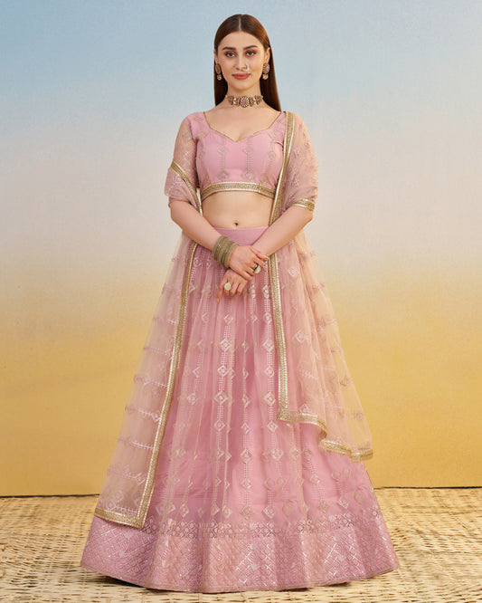 Woman wearing a pink traditional outfit with a gradient background