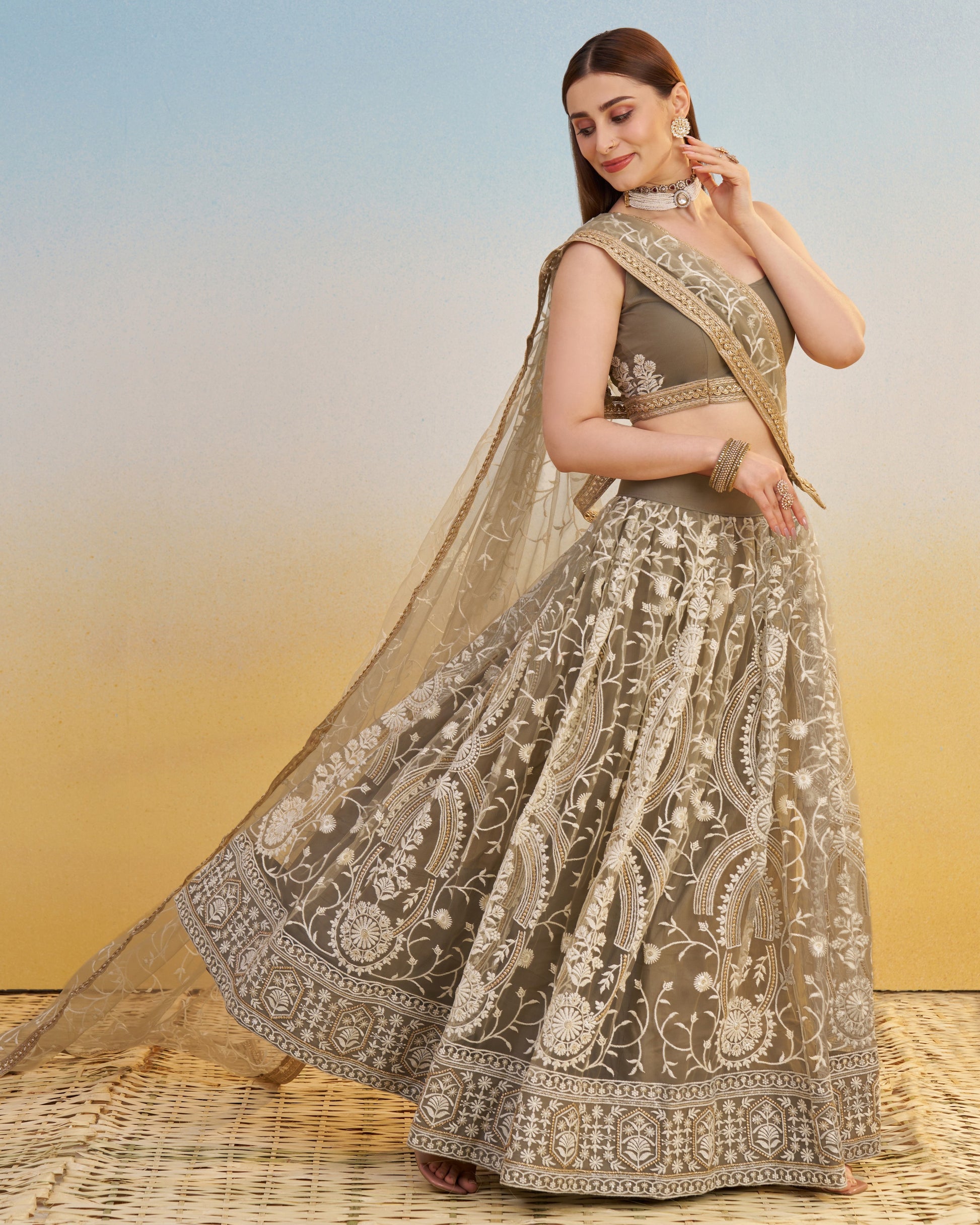 Woman in a traditional embroidered lehenga with a blurred background