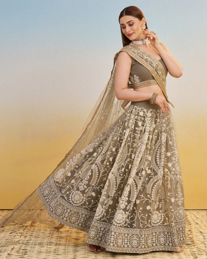 Woman in a traditional embroidered lehenga with a blurred background
