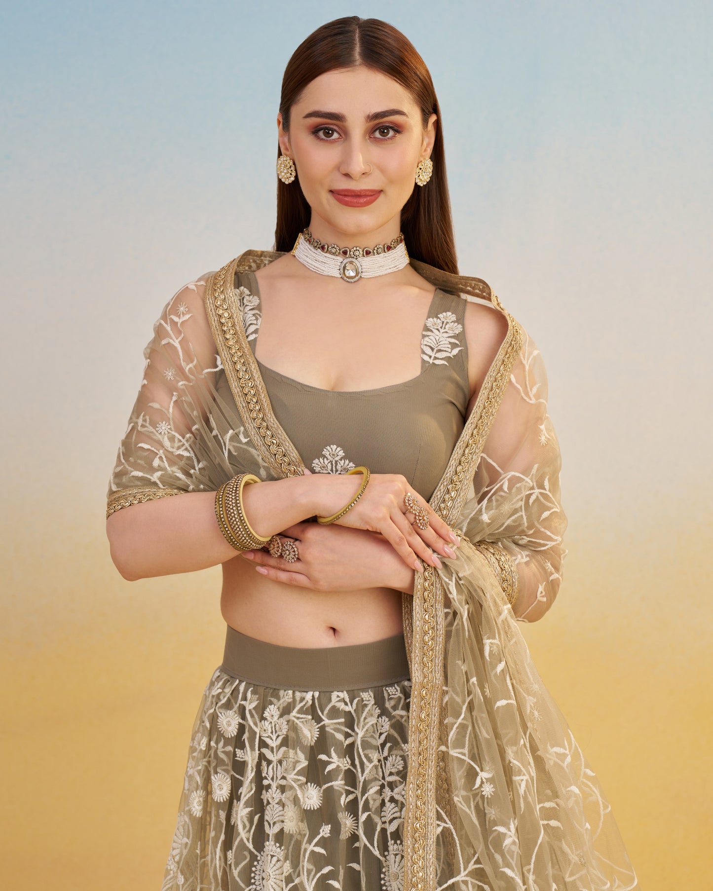 Woman wearing a traditional outfit with a floral design on a gradient background