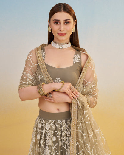 Woman wearing a traditional outfit with a floral design on a gradient background