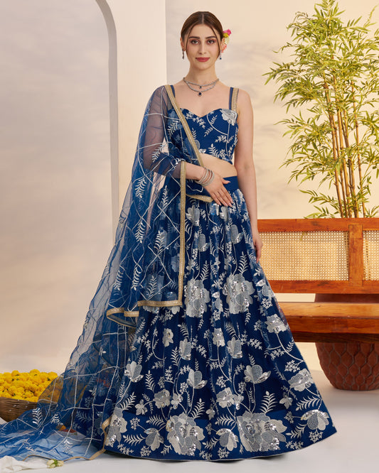 Woman wearing a blue floral dress with a white background