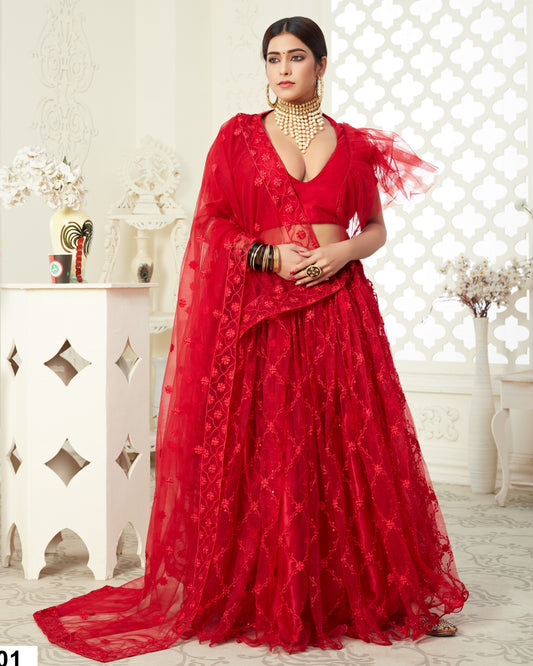 Woman wearing a red traditional outfit with intricate designs in a decorative setting.
