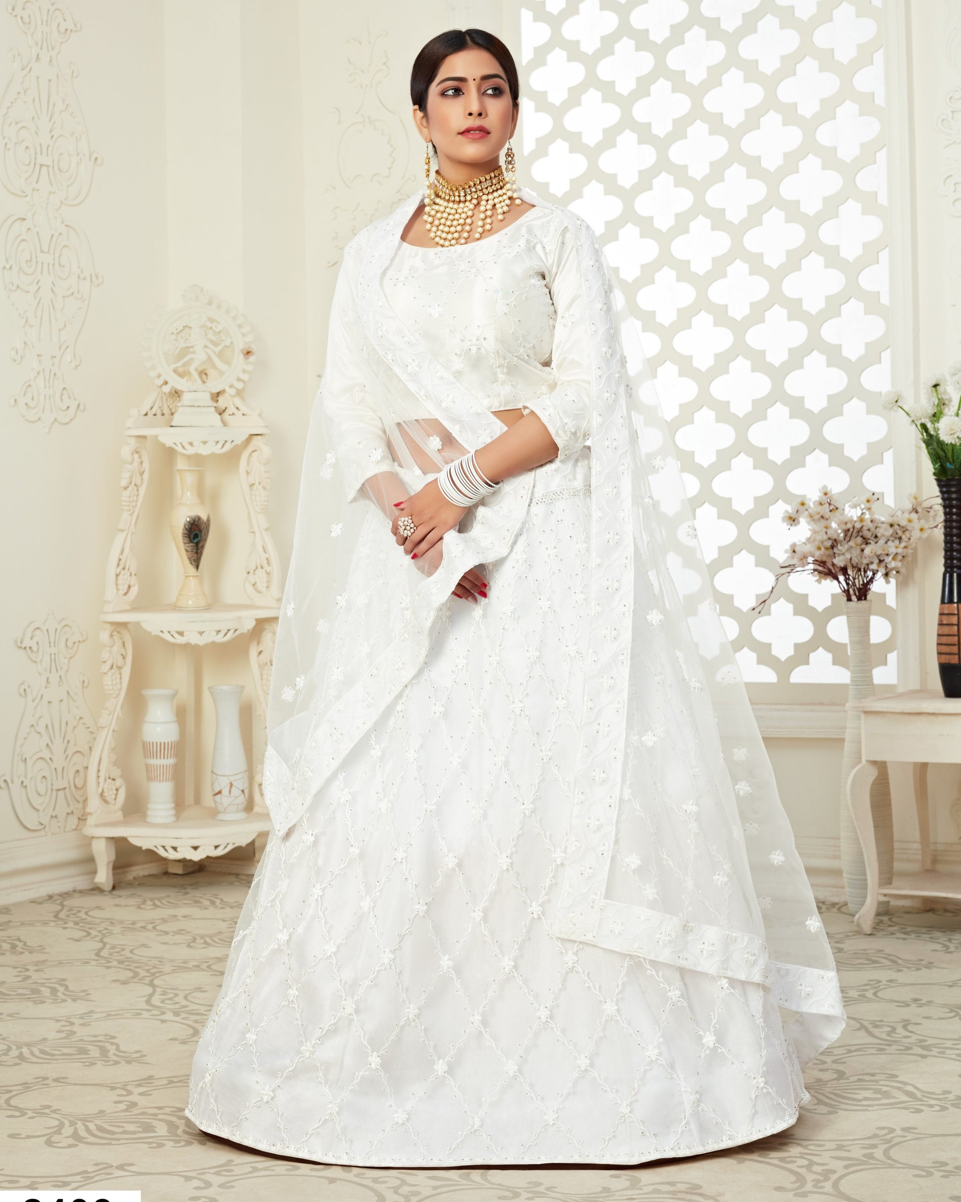 Woman in a white traditional outfit with a lattice background