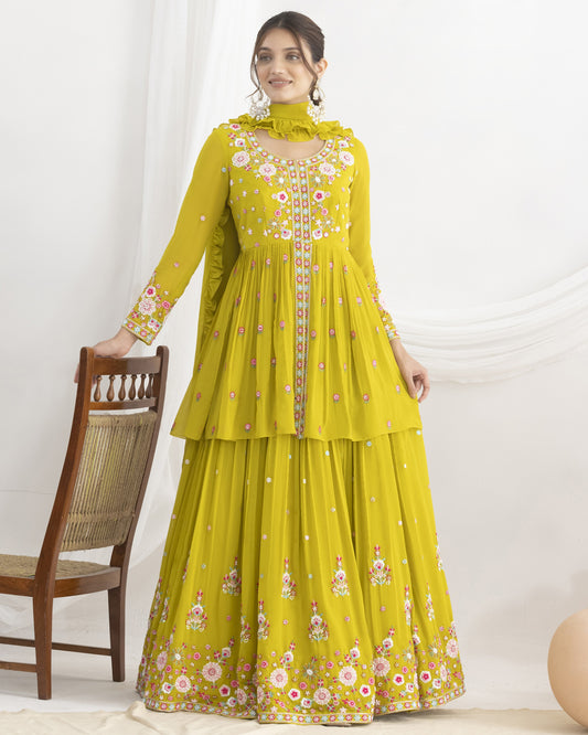 Woman wearing a yellow floral dress against a white background